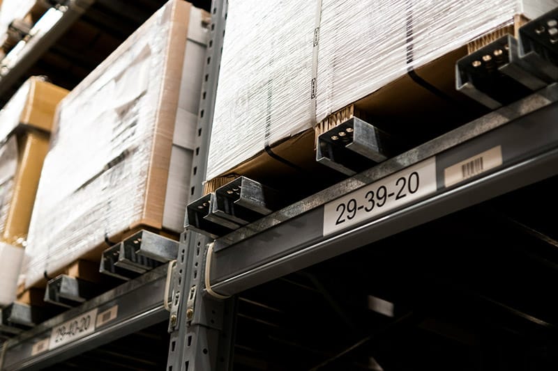 Industrial warehouse shelving with packaged items